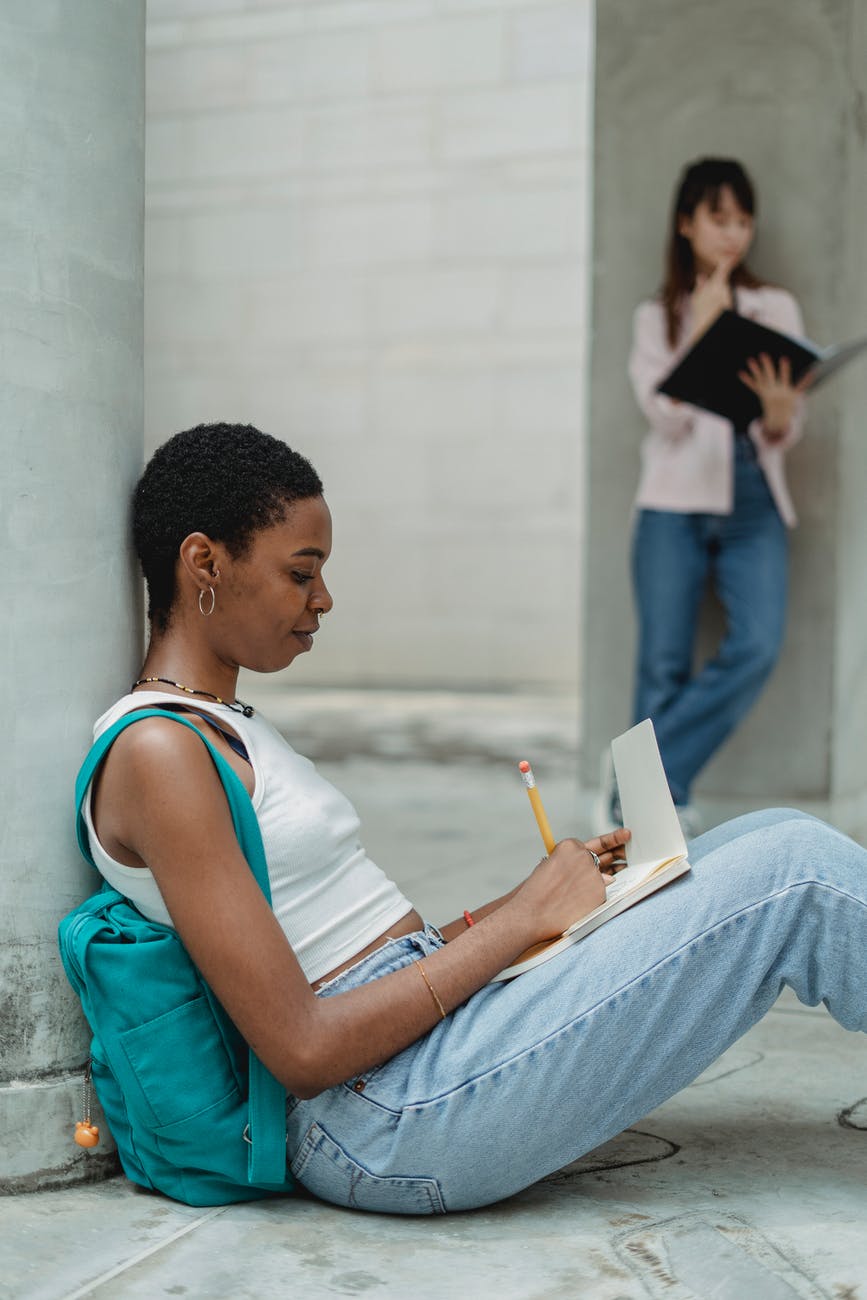 diverse students doing homework together